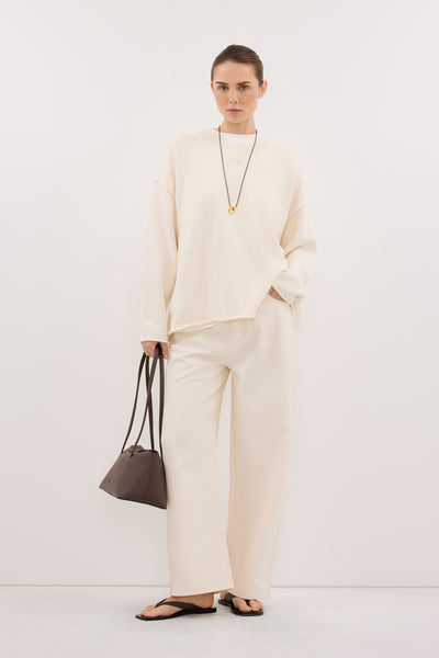 Stas wearing FLINT CREAM V NECK KNIT JUMPER