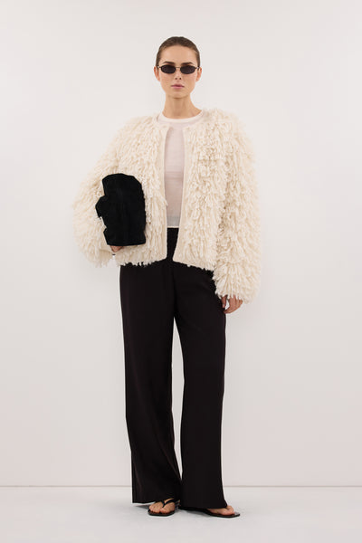 Stas wearing LANA CREAM LONGLINE KNIT CARDIGAN