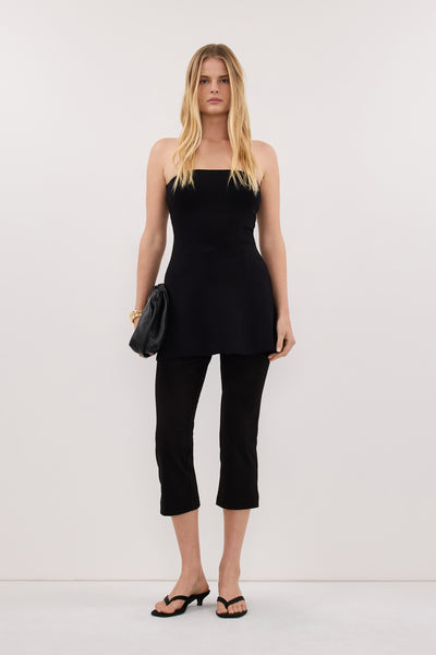 Zoe wearing COCO BLACK LONGLINE BANDEAU KNIT TOP