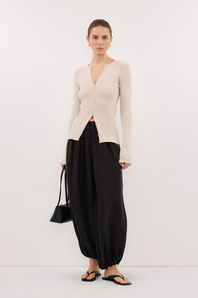 Stas wearing KAIA NATURAL RUFFLE KNIT CARDIGAN