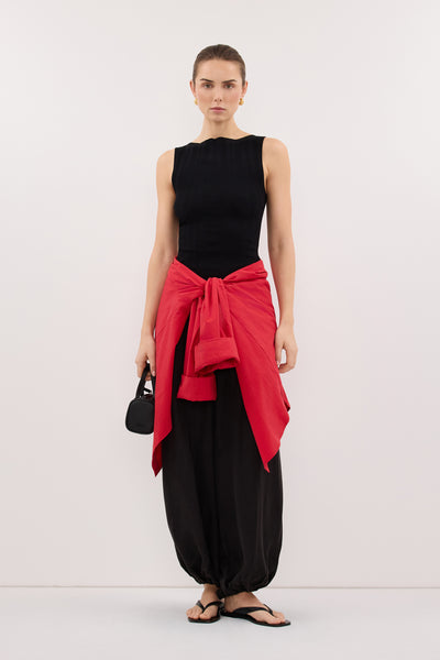 Stas wearing DOVE BLACK SLEEVELESS RIBBED KNIT TANK