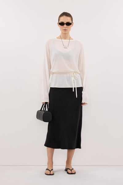 Stas wearing DUKE OFF WHITE TIE MERINO KNIT TOP